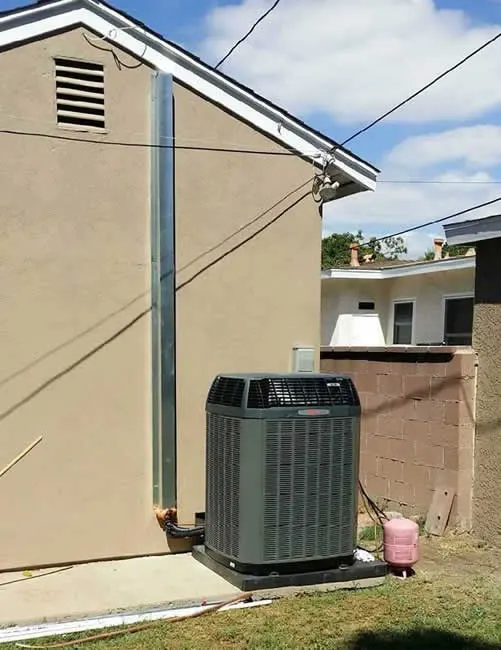 New condenser on a concrete pad