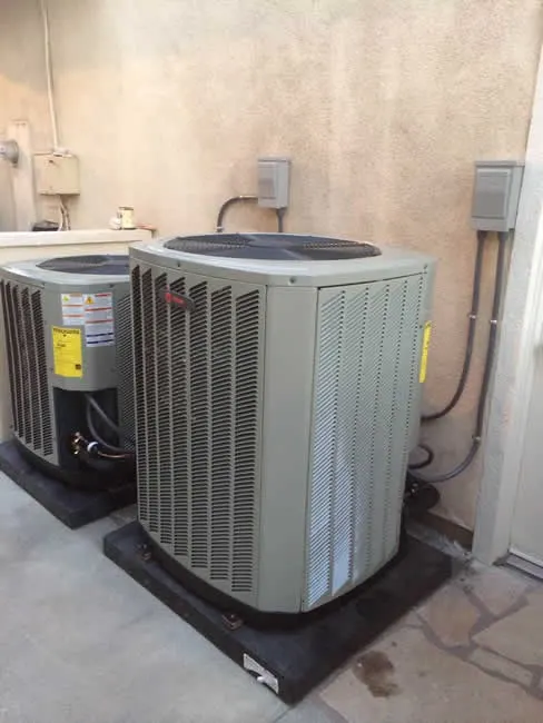 Two new AC condensers side by side